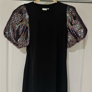 QUEEN OF SPARKLES. Black dress. Sequin puff sleeve. Size small.